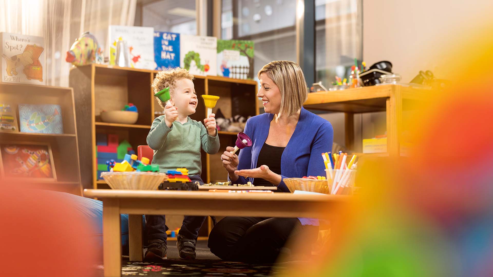 A TAFE Queensland childcare student playing with a child